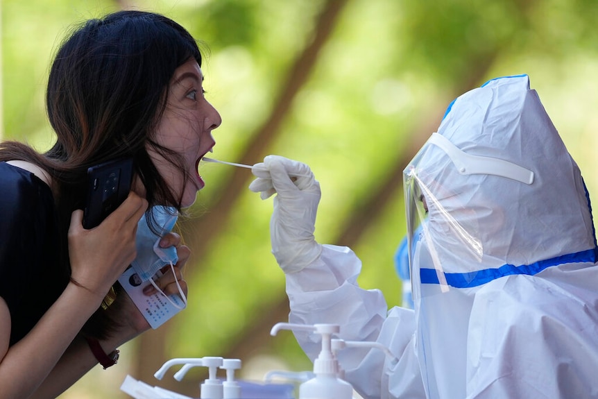 a woman gets PCR test