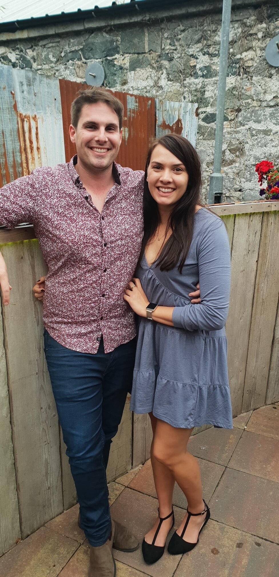 An image of a man and a woman smiling at the camera.