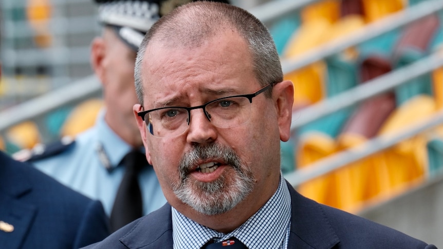 Dr Peter Aitken speaks at a media conference in Brisbane.