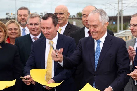 Mark McGowan and Malcolm Turnbull cutting yellow ribbon at an event in Perth.