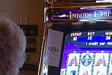 Gambler at a poker machine