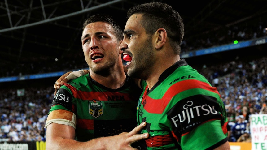 Rabbitohs Sam Burgess and Greg Inglis celebrate in the 2014 NRL grand final against the Bulldogs.
