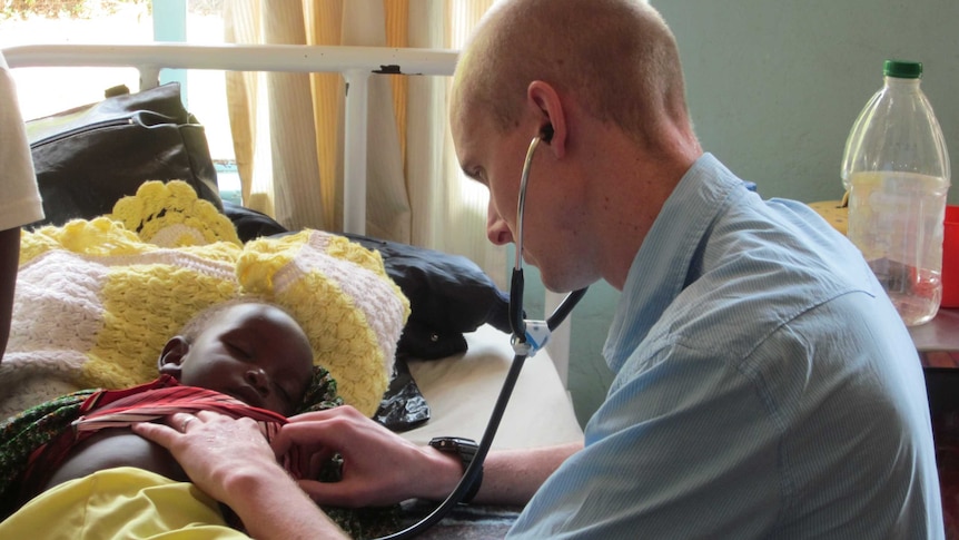 A doctor attends to a young patient