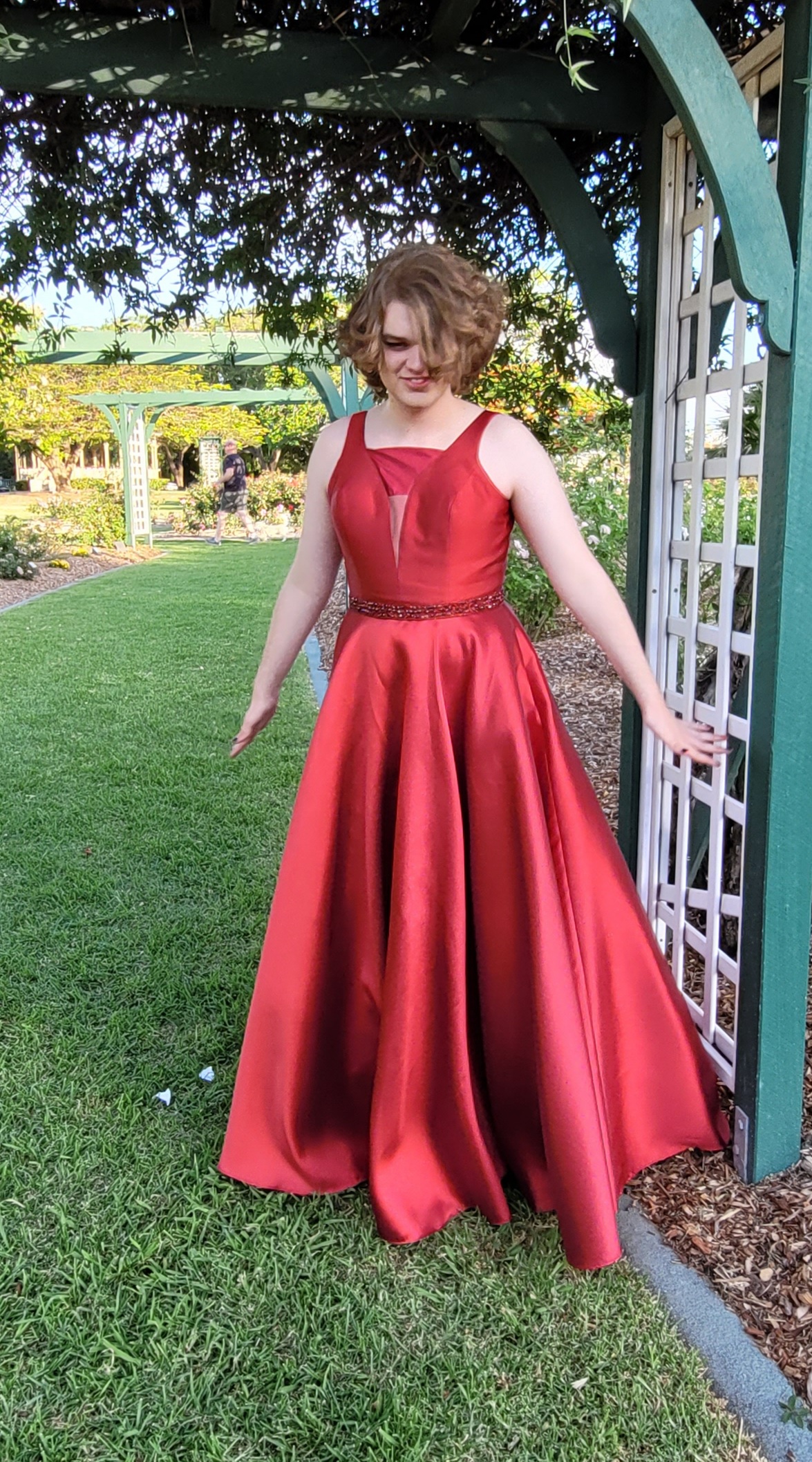 A girl in a red formal dress.