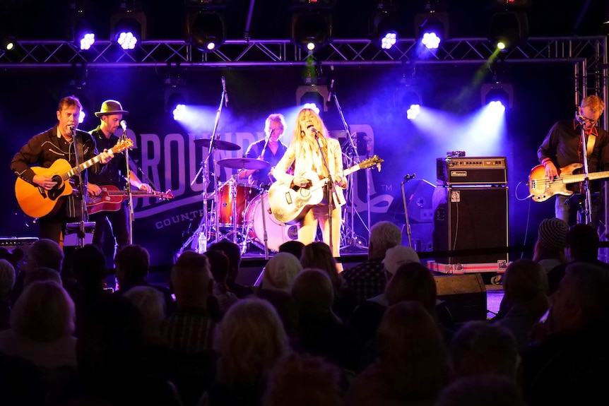 Felicity Urquhart performing on stage at the Groundwater Country Music Festival with her band