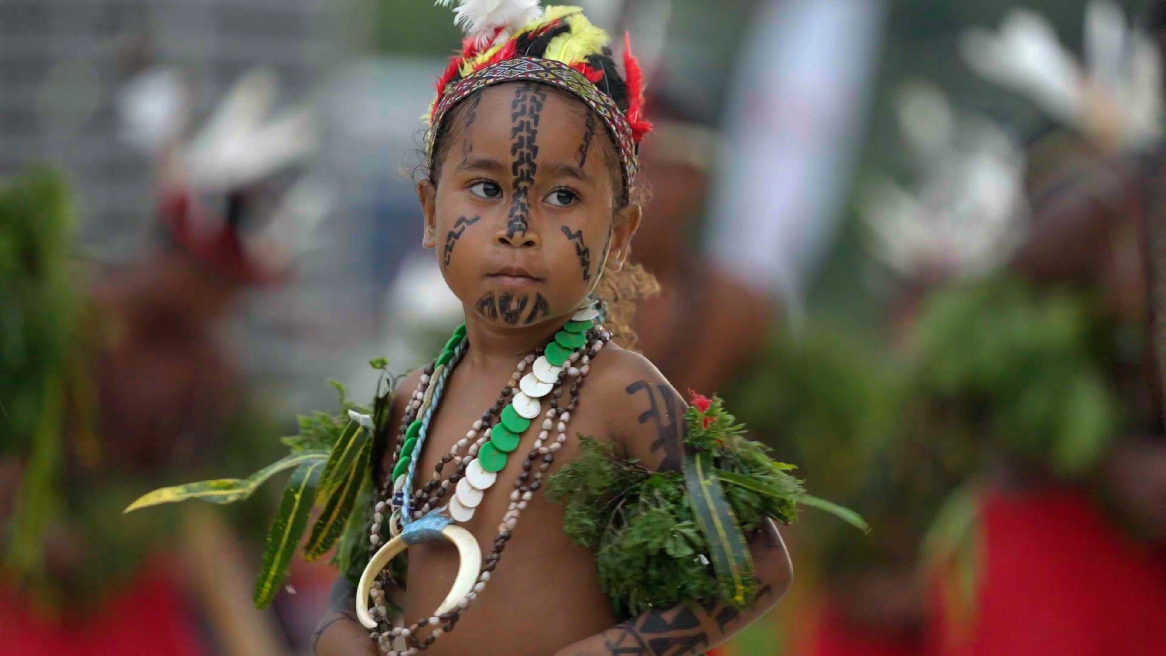 Close up of young girl from PNG in traditional costume. 