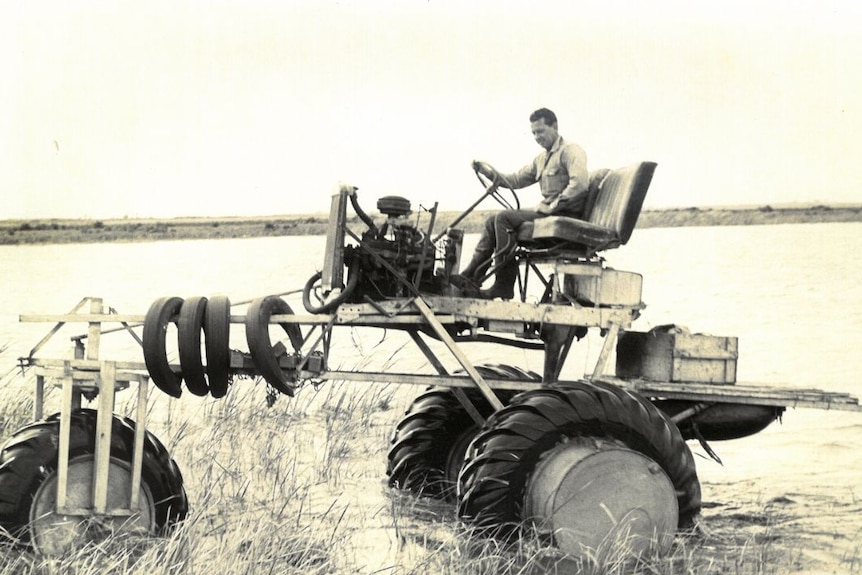 An archival photo of a homemade farming machine.