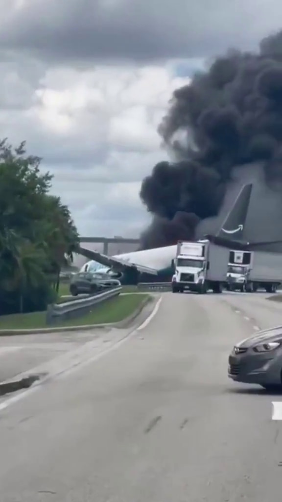 Amazon plane overruns runway and bursts into flames at Miami Airport