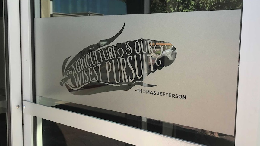 A revolving door bearing the quote "Agriculture is our wisest pursuit - Thomas Jefferson"