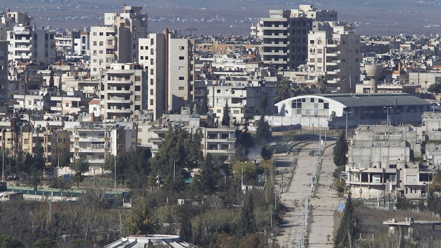 A general view shows the entrance of the Waer district in the central Syrian city of Homs.