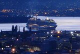 A cruise ship arrives in Hobart just before sunrise.