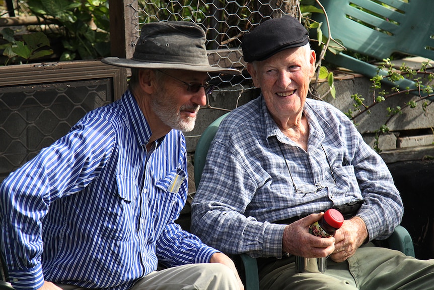 Two men chatting at the Brookfield Food Swap, west of Brisbane.