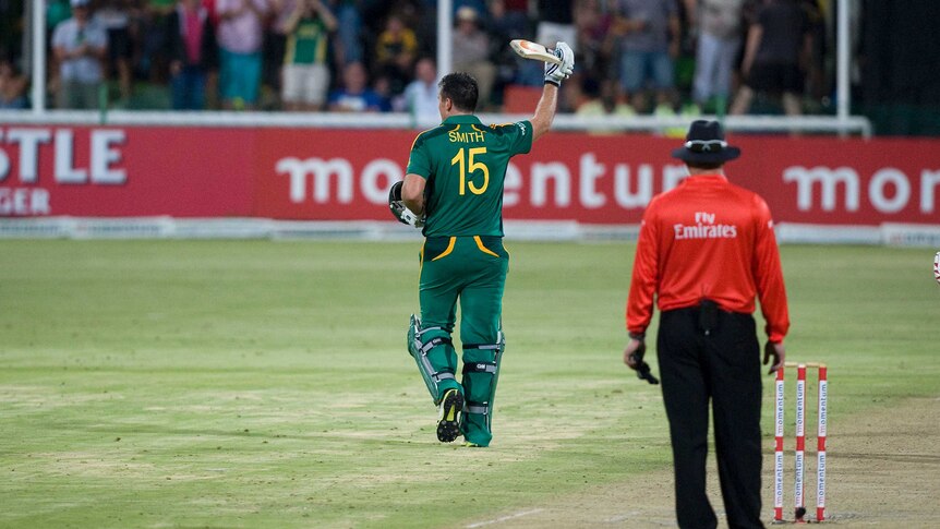 South Africa's Graeme Smith (C) celebrates his century in the third ODI against New Zealand.
