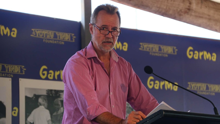 Federal Minister for Indigenous Affairs Nigel Scullion stands at a podium at the Garma Festival.