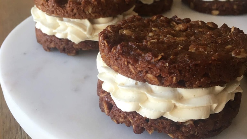 Andy Bowdy's ANZAC biscuits with rosemary-infused chocolate ganache and golden syrup butter cream.