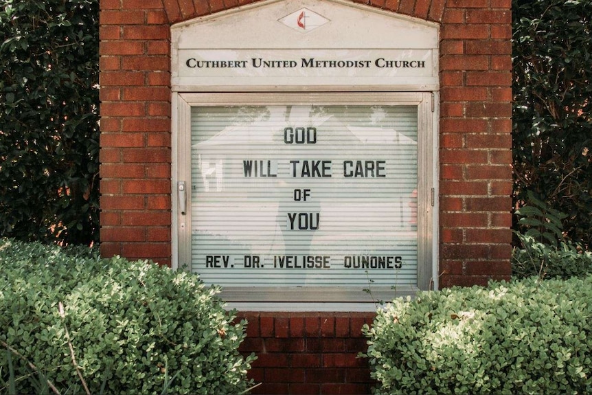 A church sign reading "God will take care of you"