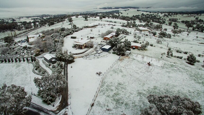 aerial view of a town blanketed in snow