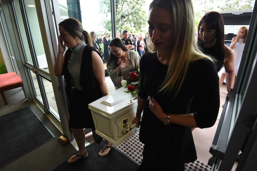 Mourners carry the coffin of murdered mother Tara Brown