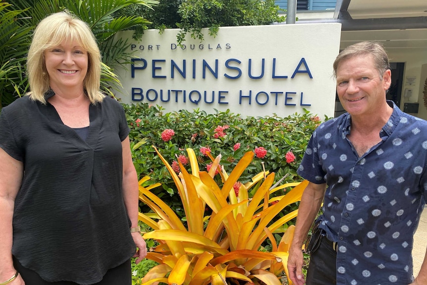 Heather and Norman English stands in from of Peninsula Boutique Hotel at Port Douglas.