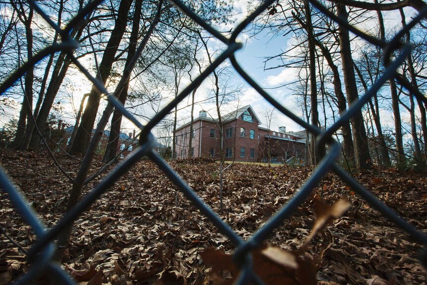A fence encloses an estate in the village of Upper Brookville.