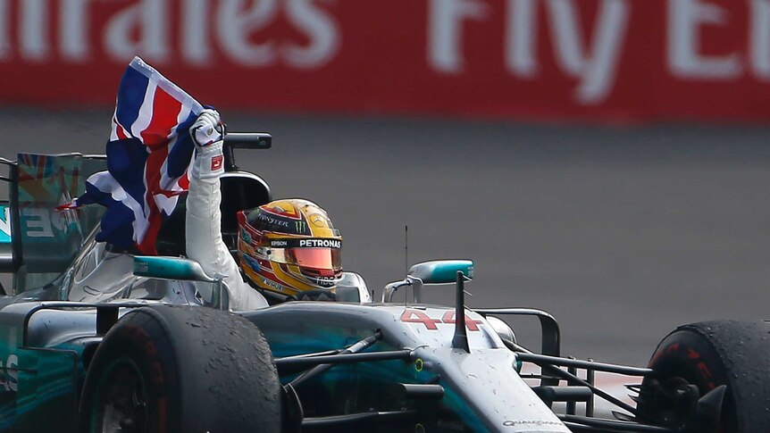 Lewis Hamilton flies the British flag from his car.