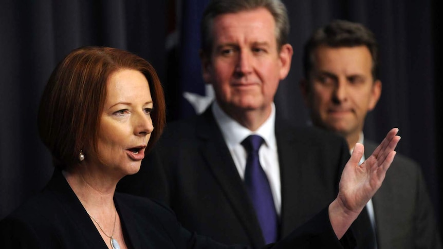 Julia Gillard (left) speaks at an NDIS press conference