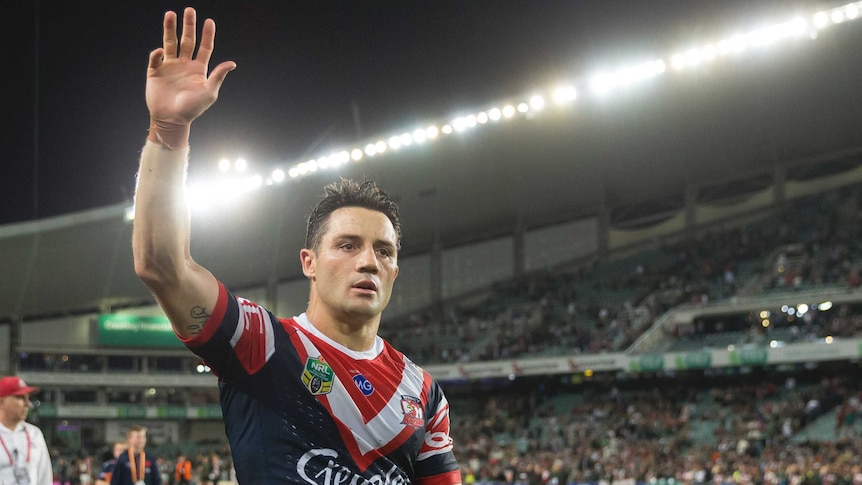 Cooper Cronk salutes the crowd after the Roosters' victory in the 2018 NRL preliminary final.
