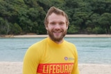 Surf lifesaver Samuel Dick standing at Tallebudgera Beach as he undergoes intense training