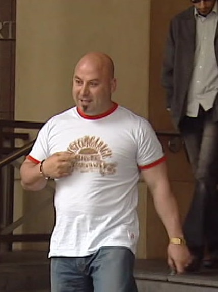 Milad Mokbel leaves the Melbourne Magistrate's Court.