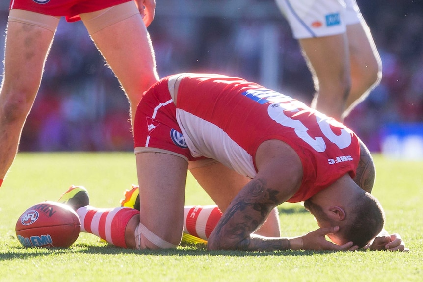 Lance Franklin suffers a knock against the Suns