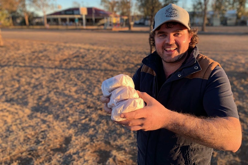 Tom Hancock from the Collie pub delivers bacon and egg rolls.