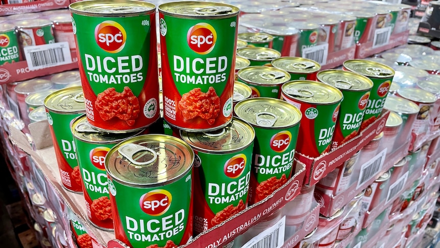A stack of canned tomatoes 