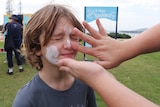 Sunscreen application on child