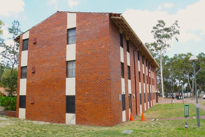 A three story red brick accommodation building at Curtin University