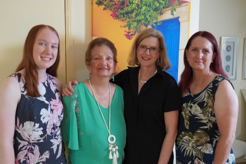 Four women of three generations pose for a photo