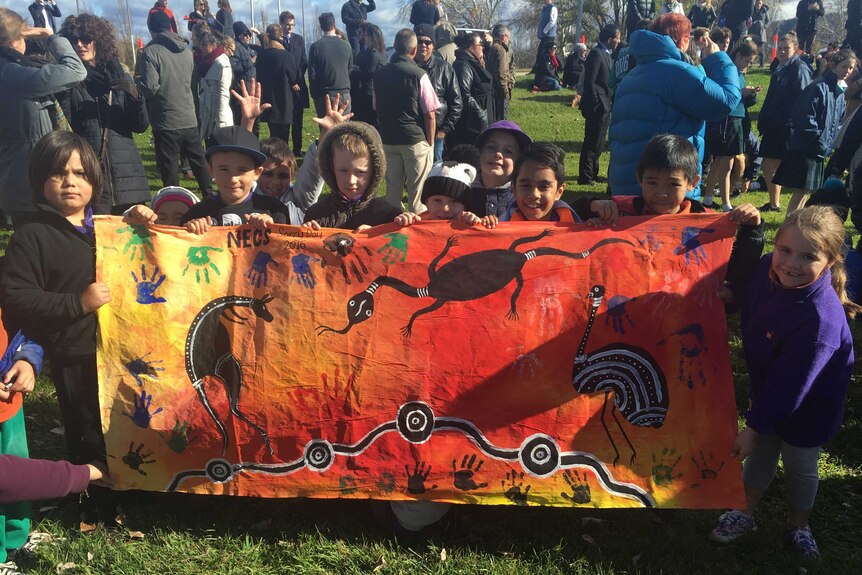 Children with a banner at the march.