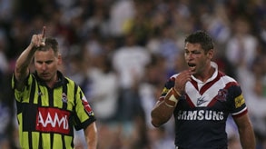 Roosters captain Luke Ricketson (r) reacts to Paul Simpkins