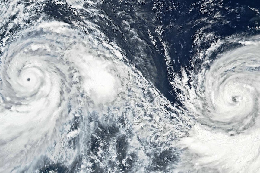 NASA satellite data shows swirling white typhoons Lekima and Krosa about 1,500km apart, eye-to-eye, over the West Pacific