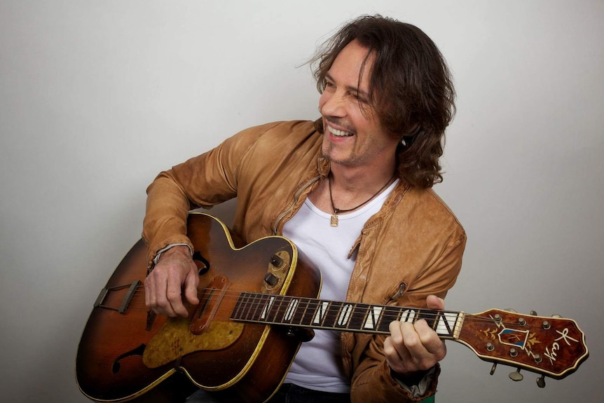 Rick Springfield with his guitar