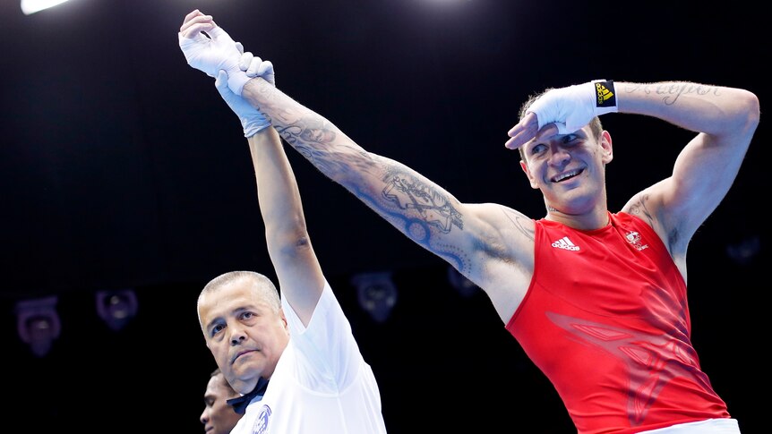 Damien Hooper smiles after winning his bout against Marcus Browne.