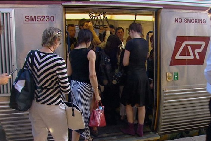 Commuters boarding a Qld Rail passenger train in Brisbane on Sept 1, 2008.