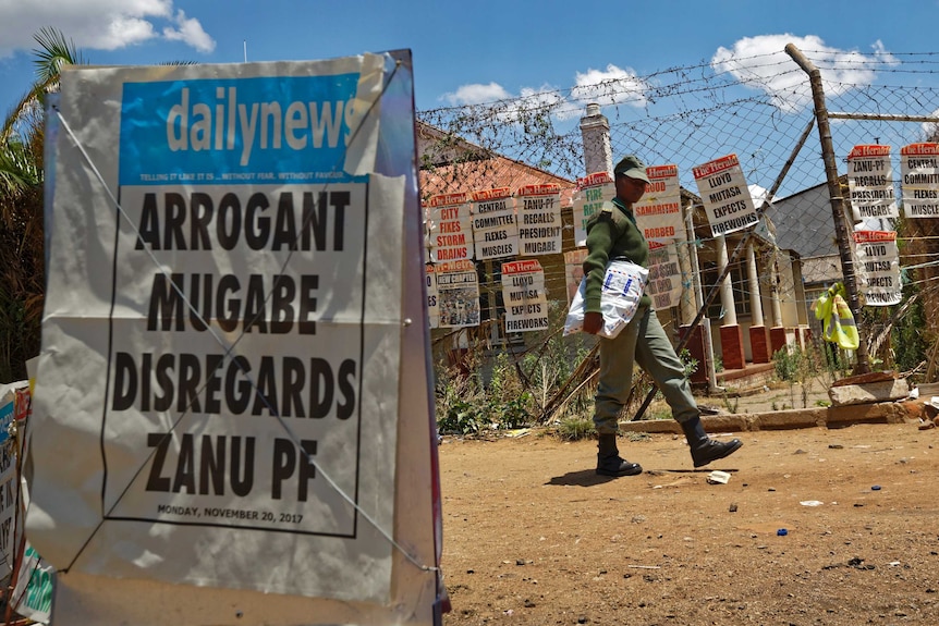 A newspaper headline reads 'Arrogant Mugabe disregards ZANU PF'.