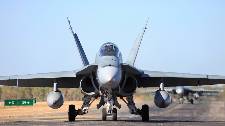 A RAAF F/A-18 taxis on a runway in Katherine.