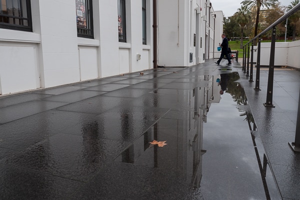 A man walks into the Drill Hall at the Torrens Parade Ground.