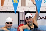 Ye Shiwen (R) celebrates with team mate Li Xuanxu after winning gold and bronze in 400IM.