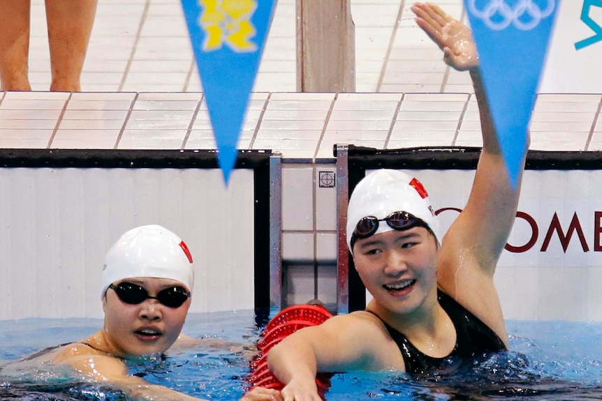 Ye Shiwen (R) celebrates with team mate Li Xuanxu after winning gold and bronze in 400IM.