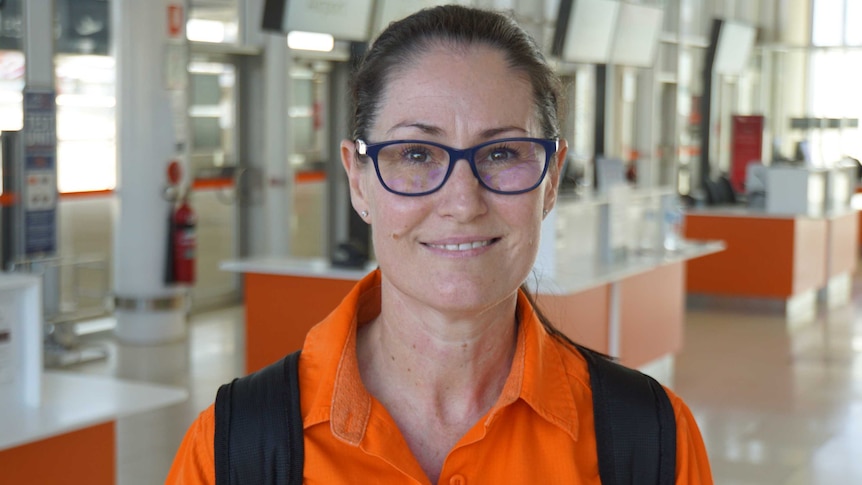 Portrait shot of BHP FIFO mine worker Cintra James at Perth Airport preparing to fly to work.