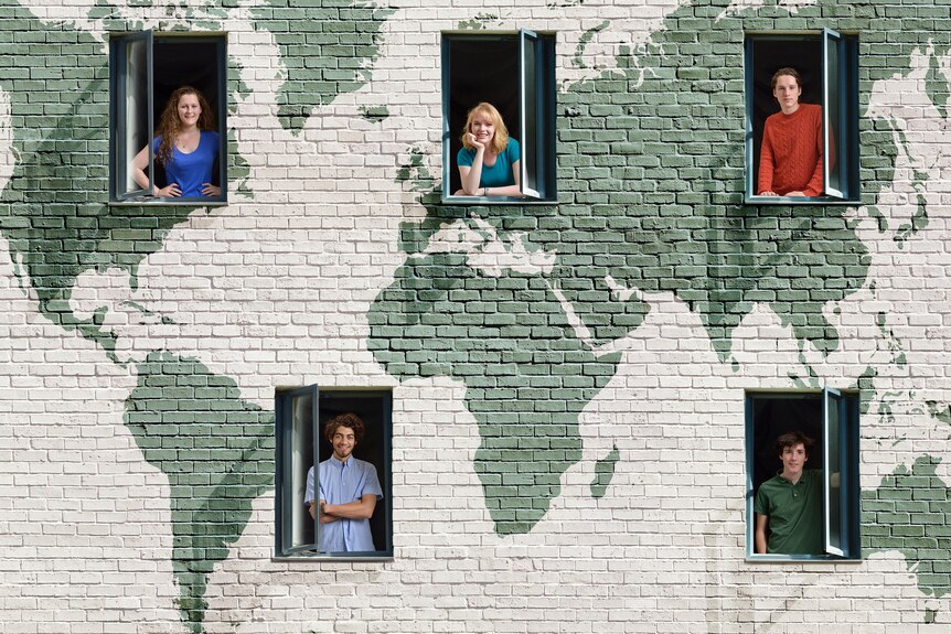 People look out their windows and smile, with a backdrop of the world painted on their building.