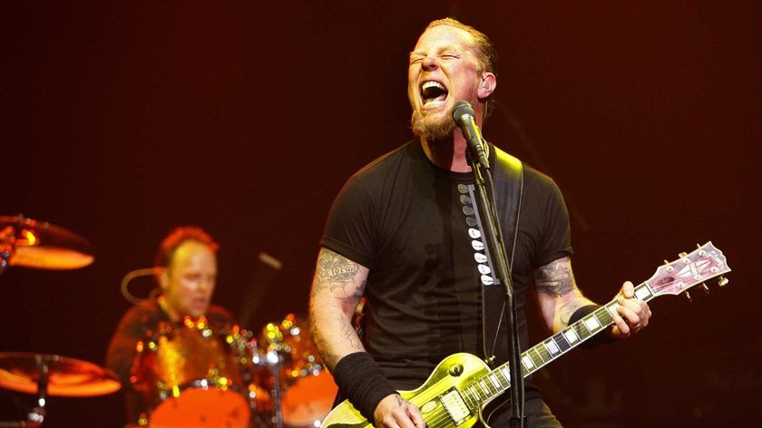Metallica lead vocalist James Hetfield, with drummer Lars Ulrich (at back)