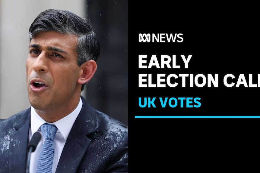 Early Election Call, UK Votes: Man in a wet suit looks off camera. 